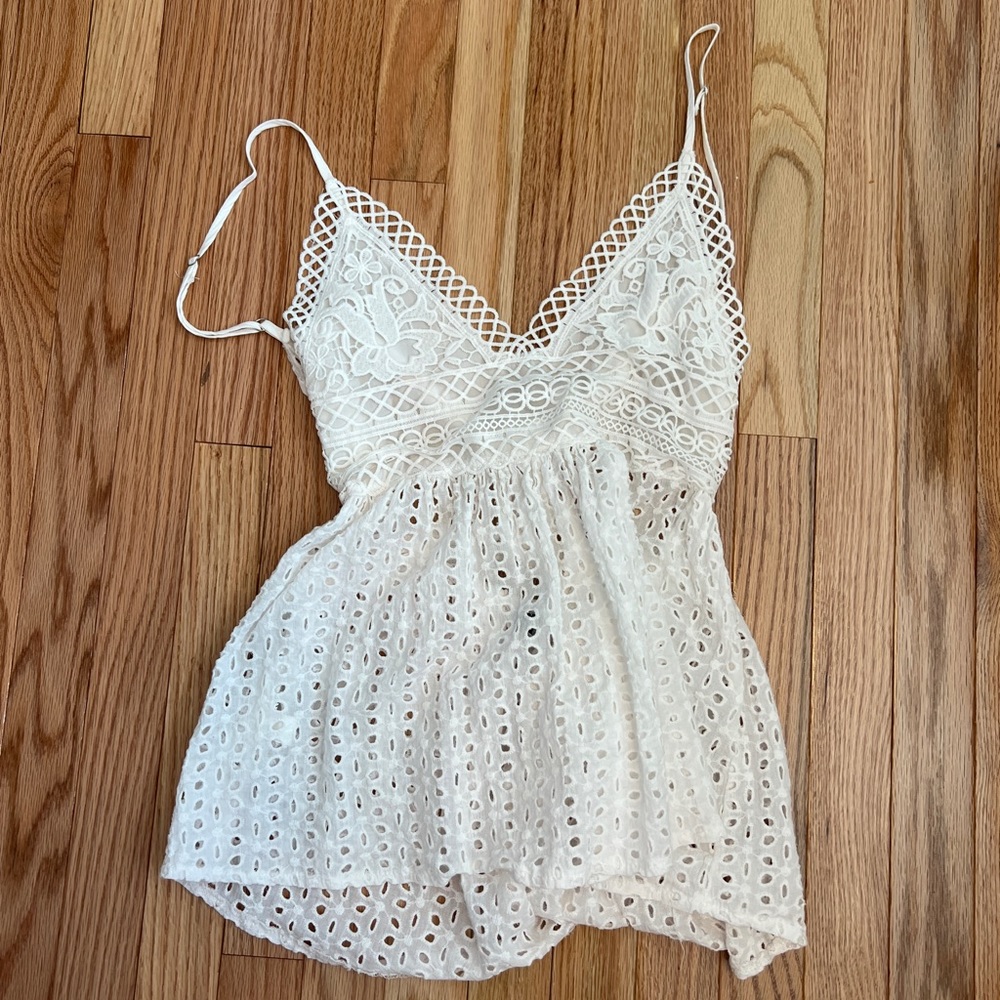 Xs could fit small, white tank top